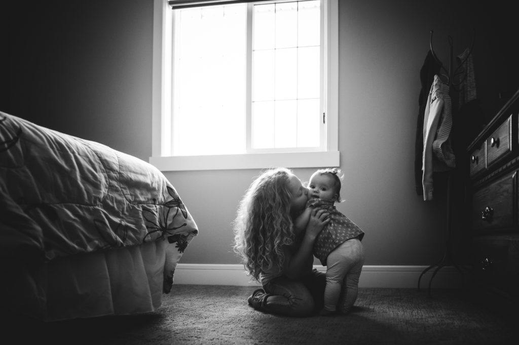 Sisters. In home lifestyle photography by Fiddle Leaf Photography. Edmonton Photographer