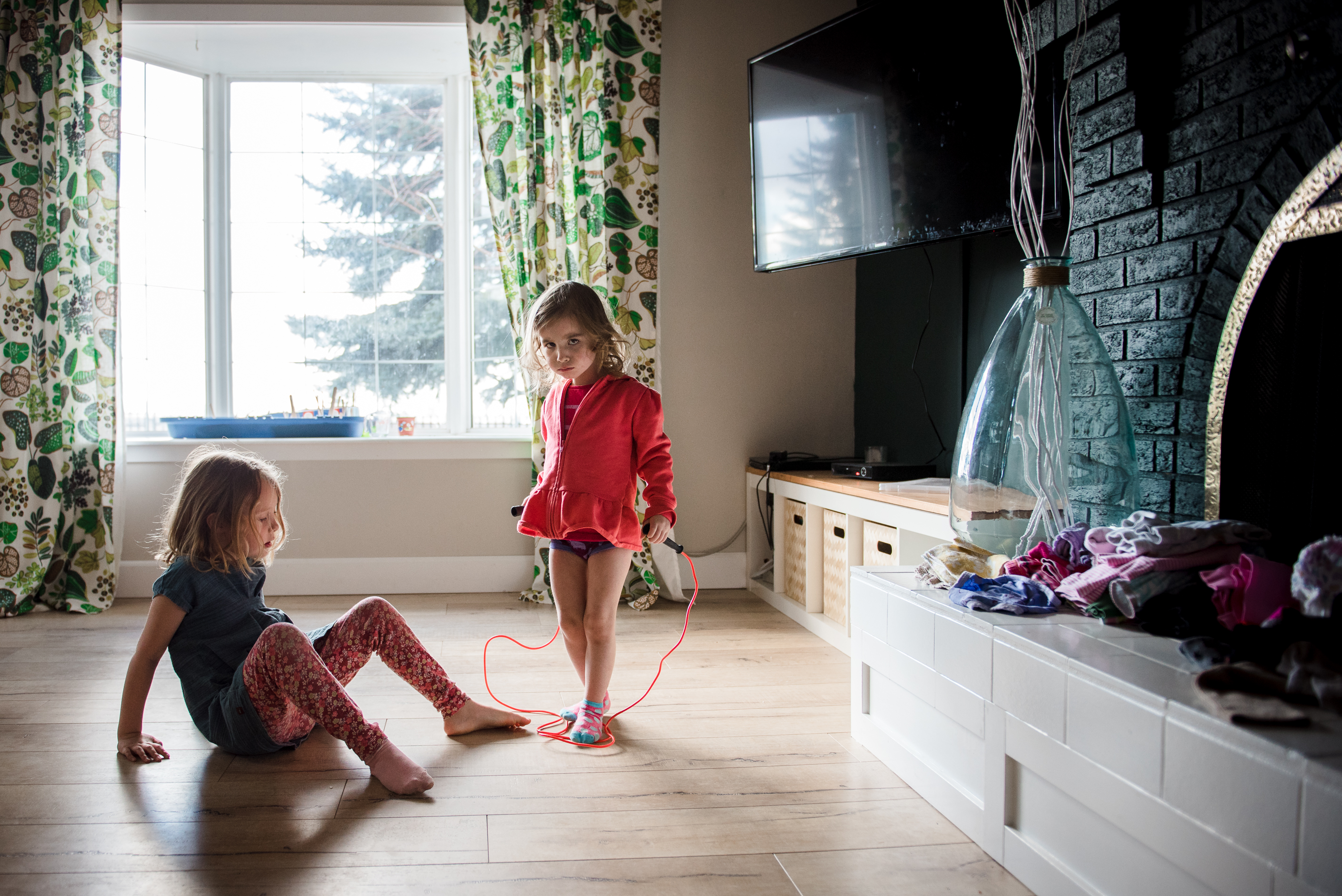 A little girl learns to skip. Documentary photographer Edmonton