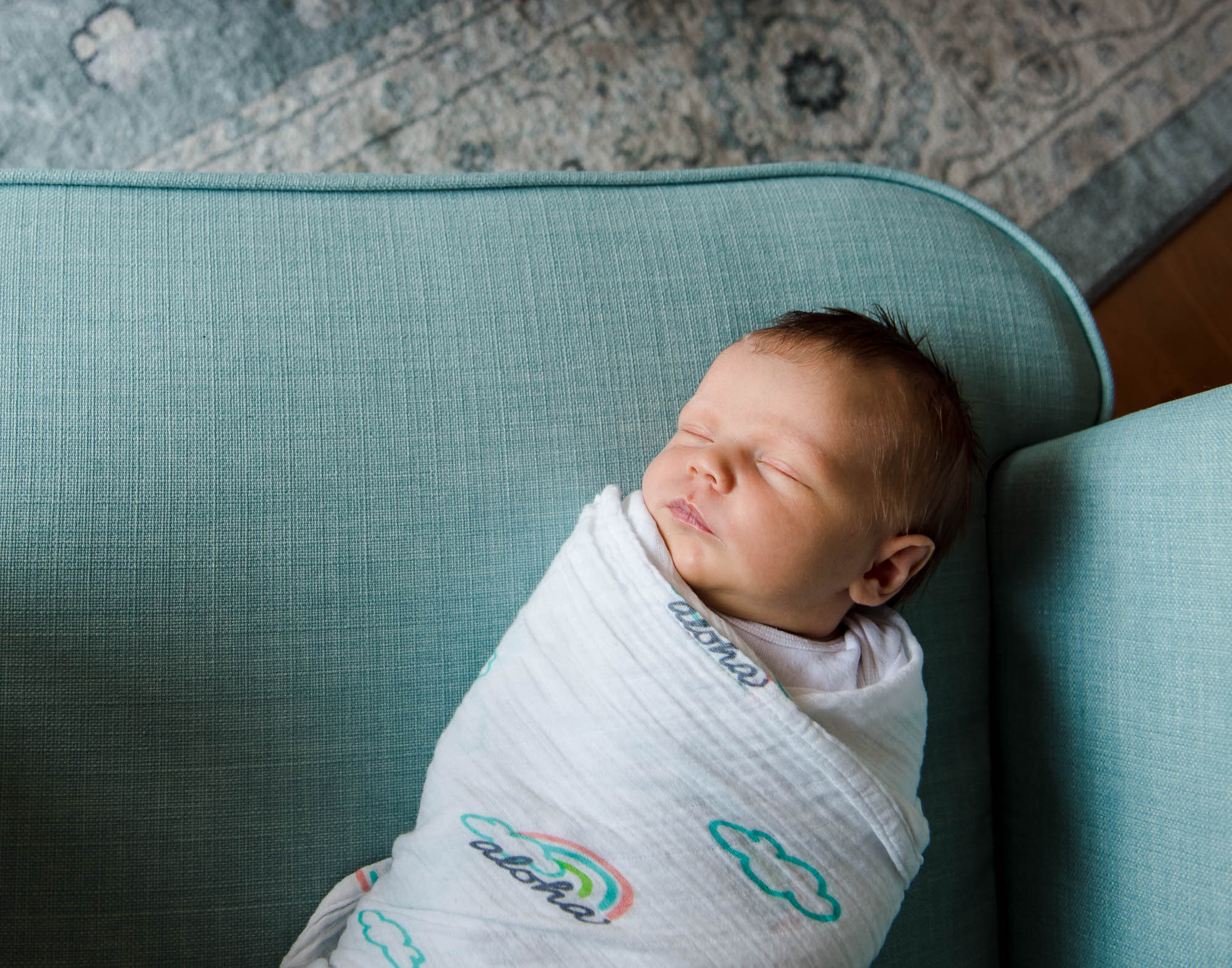 A baby sleeps during a Sherwood park newborn photo session