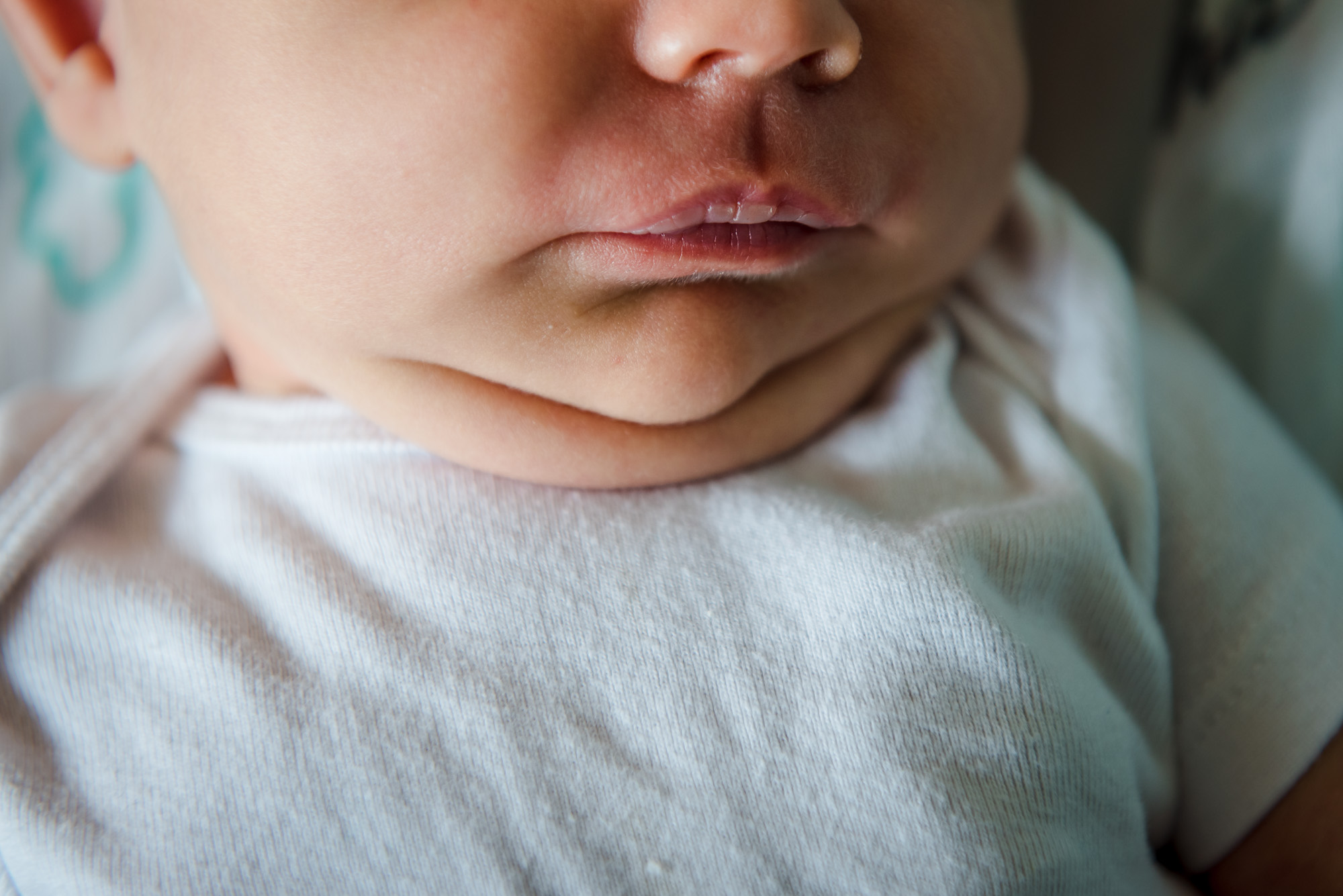 A baby's chin rolls
