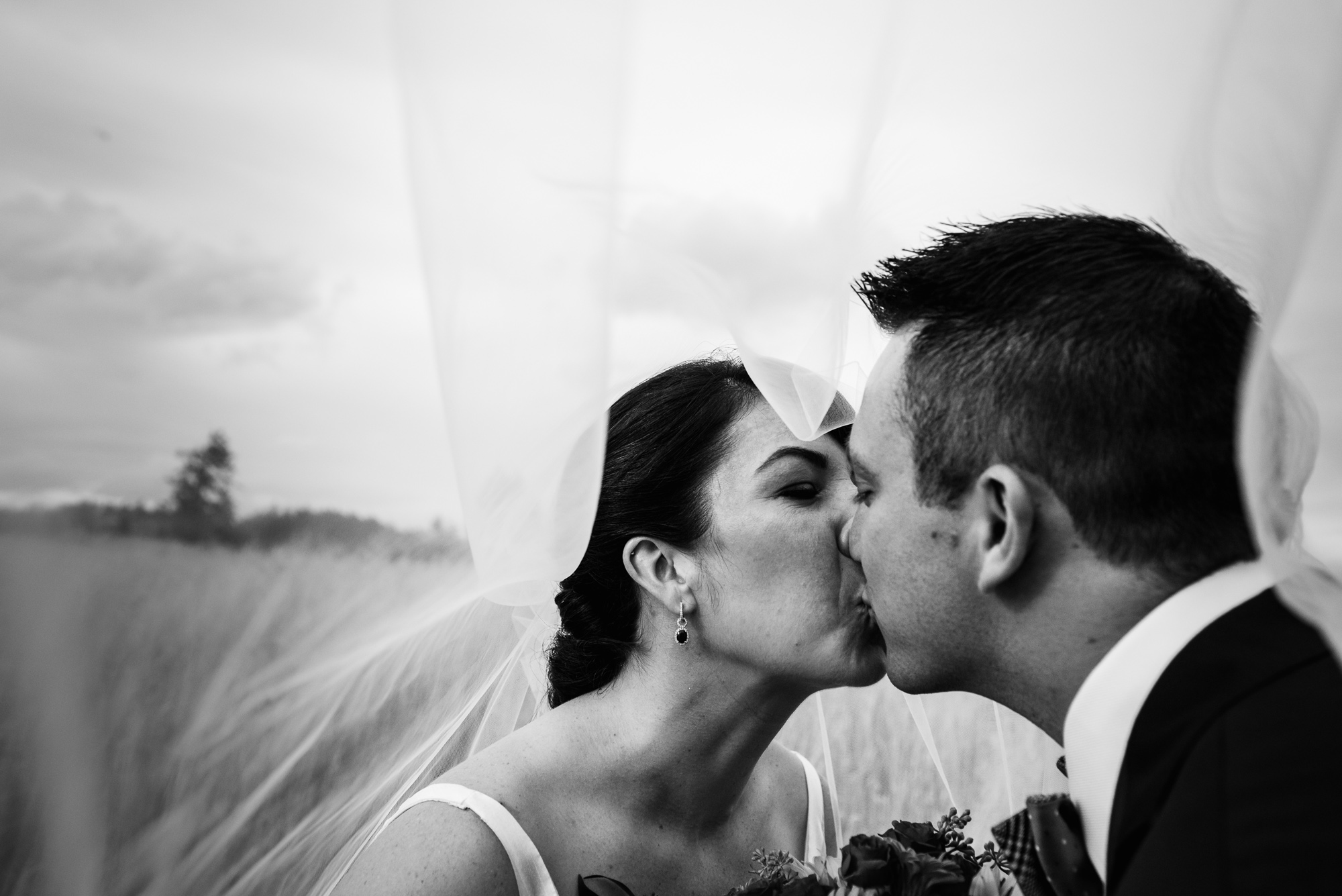 A bride and groom kiss
