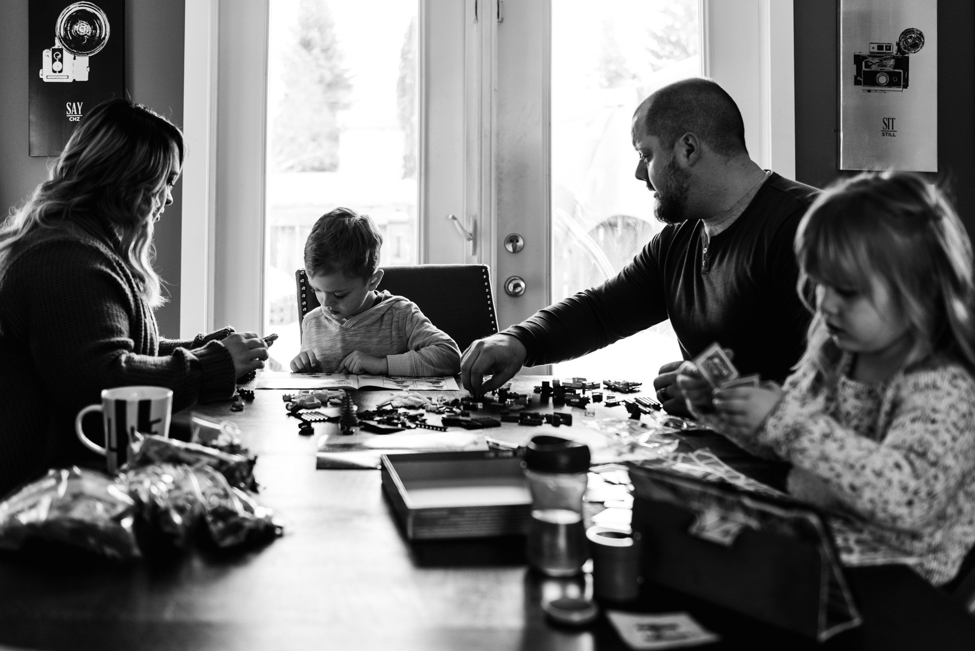 A family builds LEGO together during a family photo session Edmonton