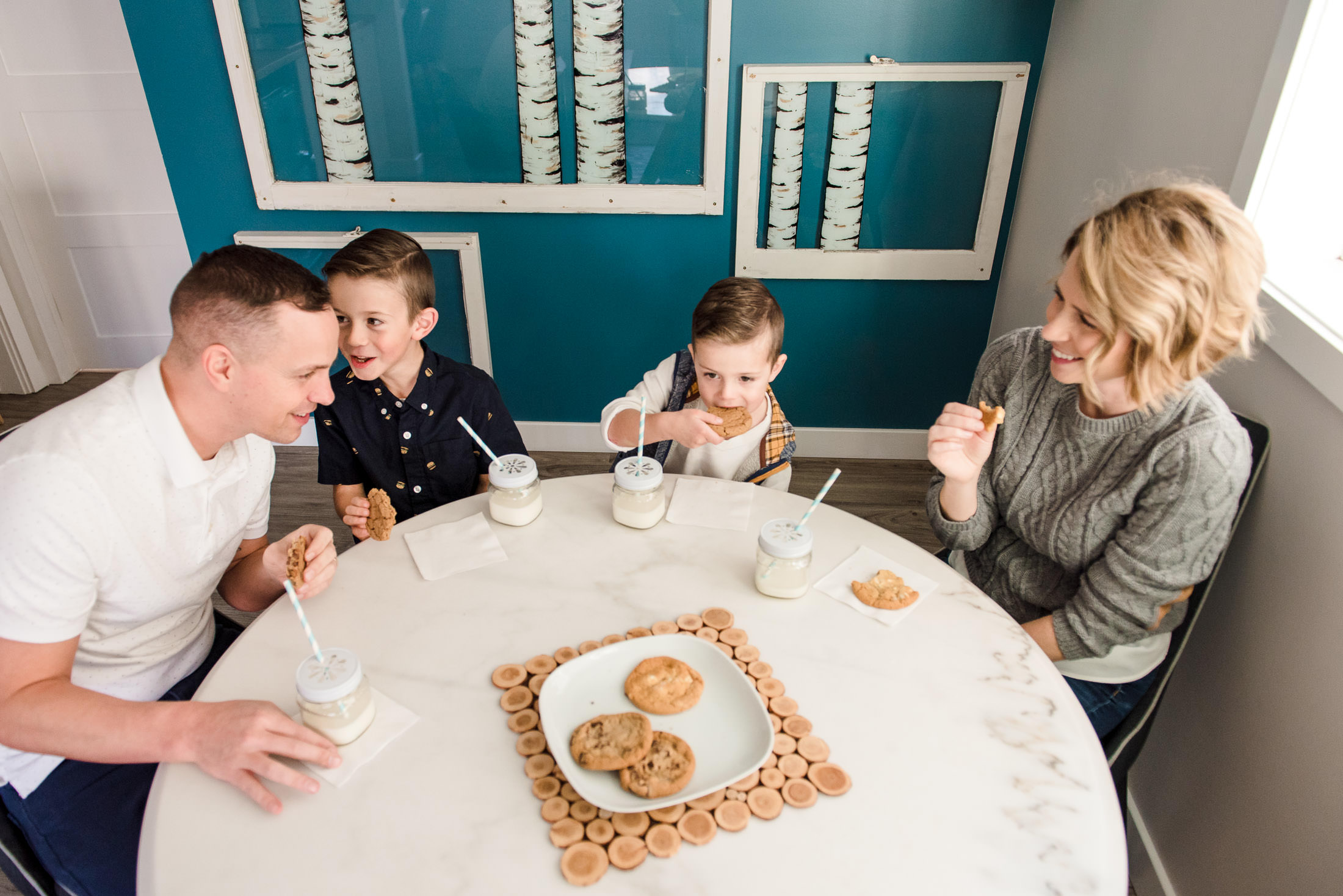 A family jokes around while eating cookies