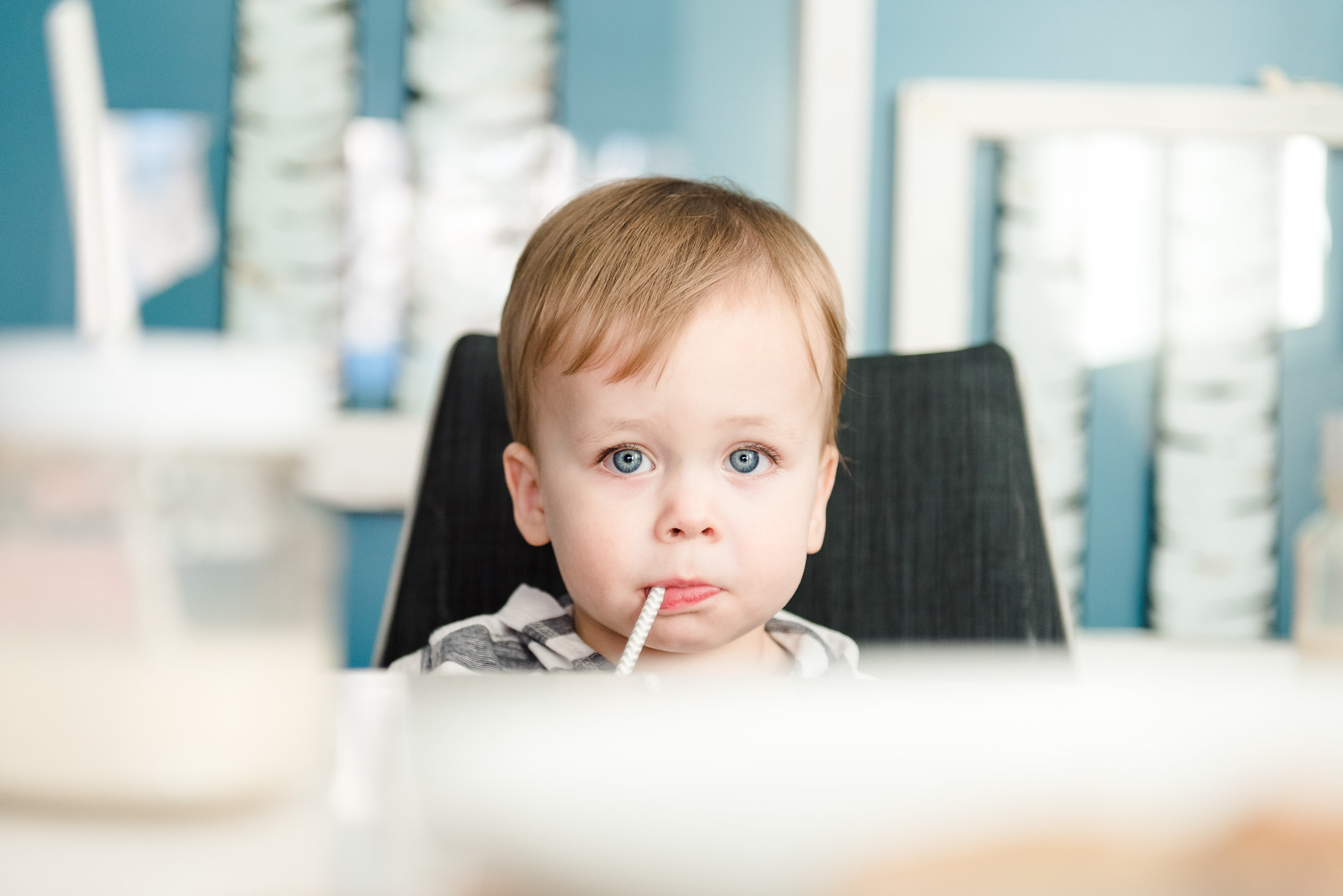 A little boy drinks milk