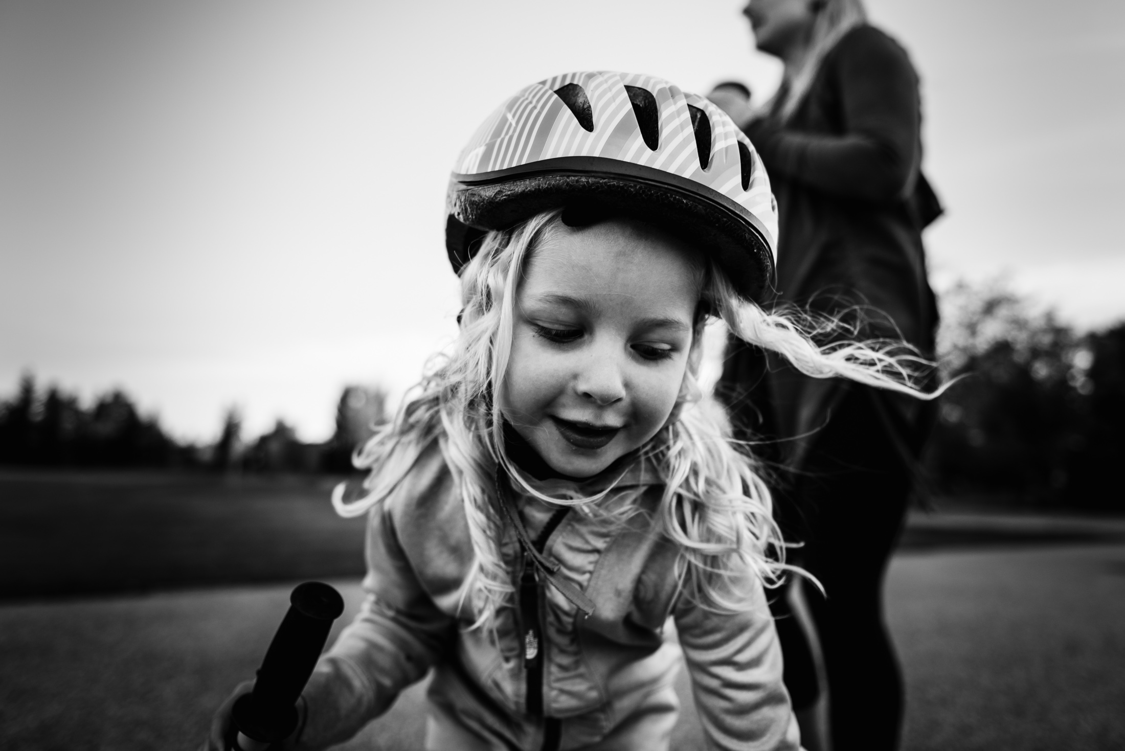 A girl's hair blows in the wind. photo by edmonton family photographer Fiddle Leaf Photography