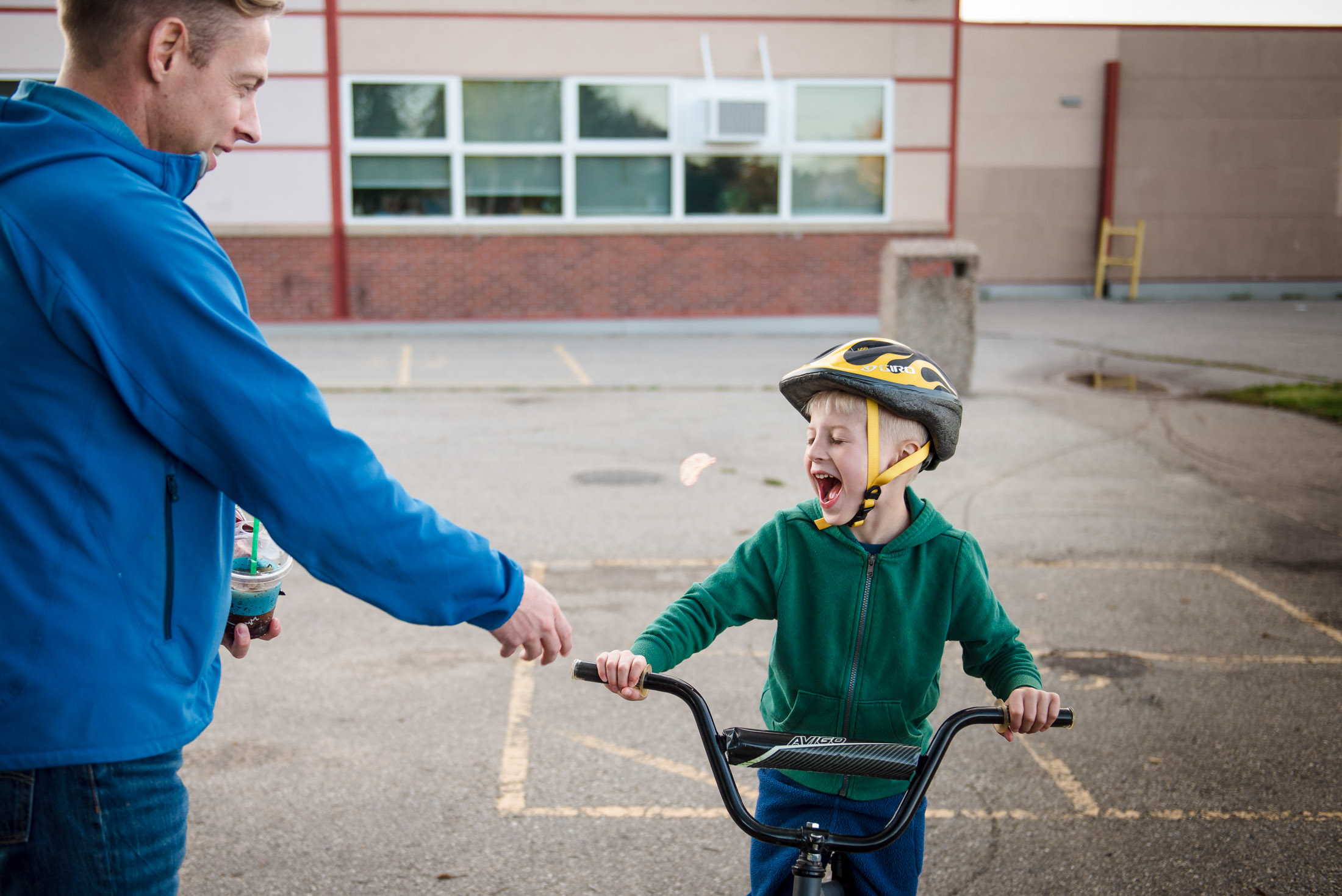 A boy tries to catch a tossed potato chip at an Edmonton park