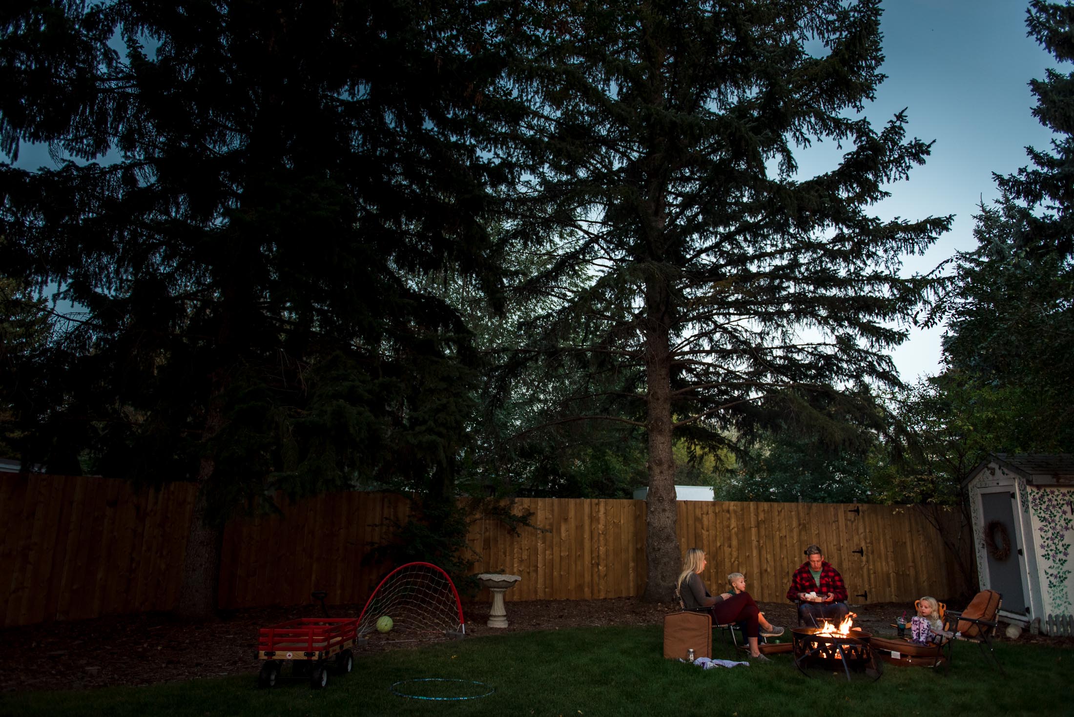 A family has a fire in their edmonton backyard in the summer