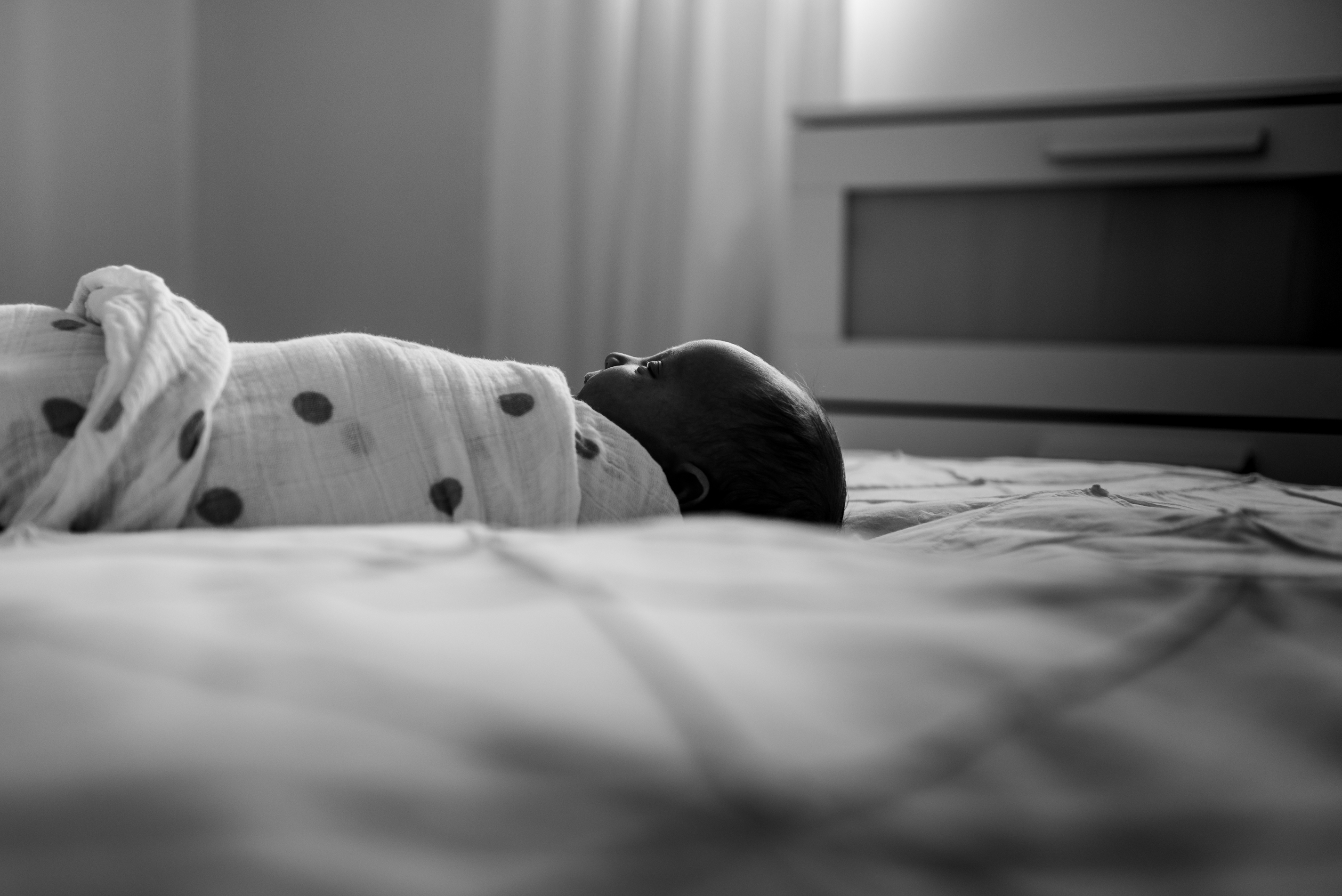 A partial silhouette of a newborn baby in a Sherwood Park home
