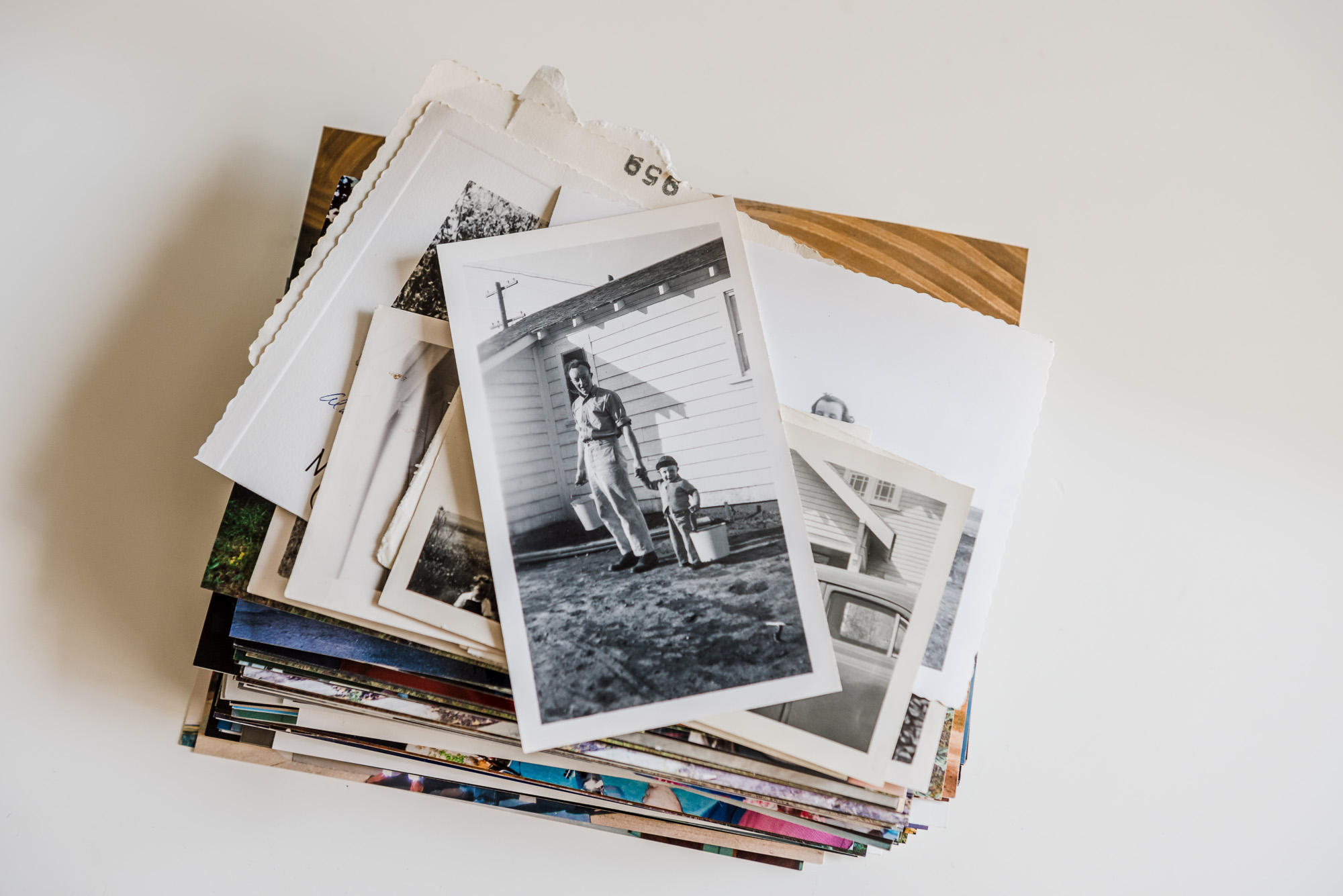 A stack of old photographs. Edmonton Photo Prints