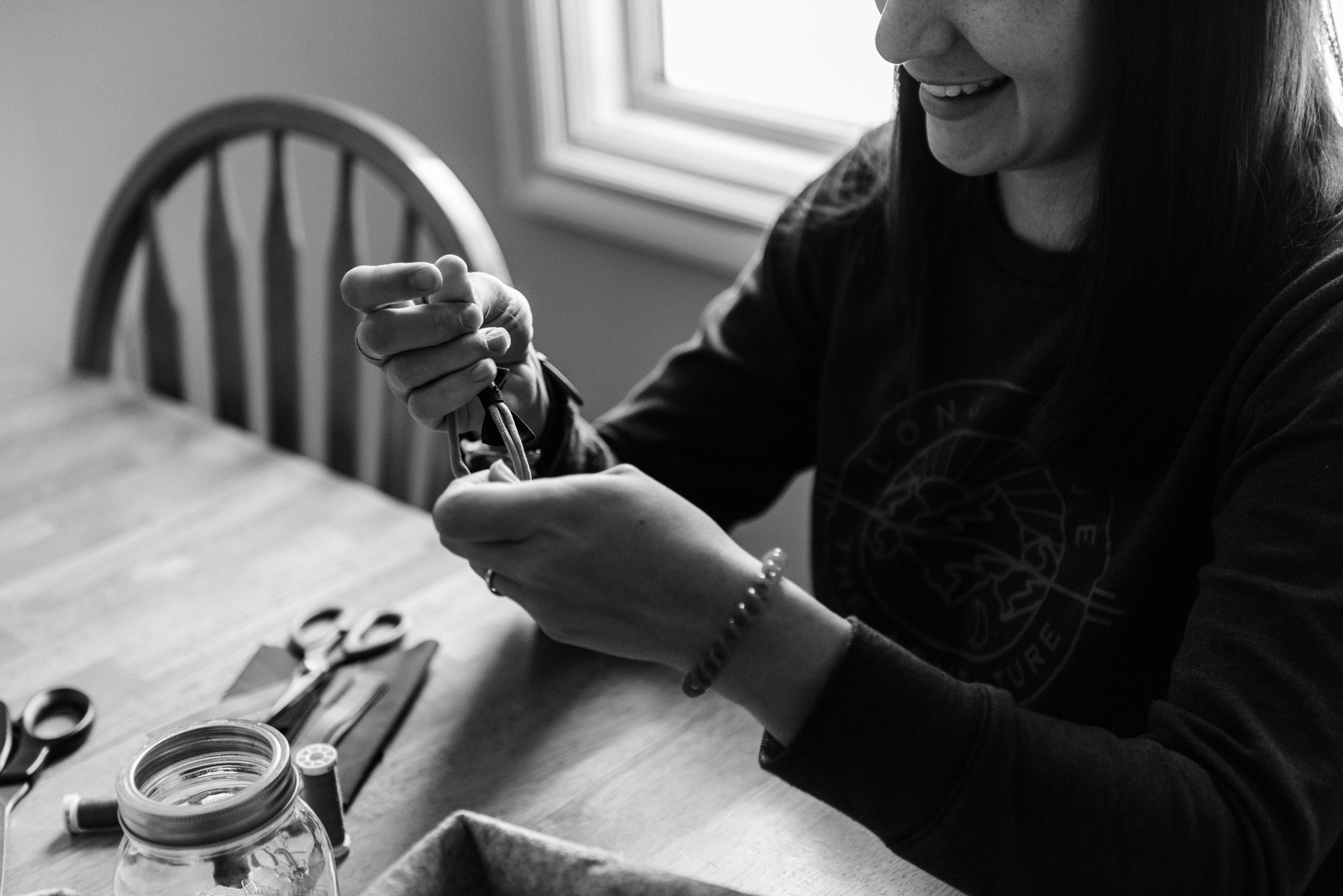 Stacey of Baby Bird Creations laughs as she makes a bow