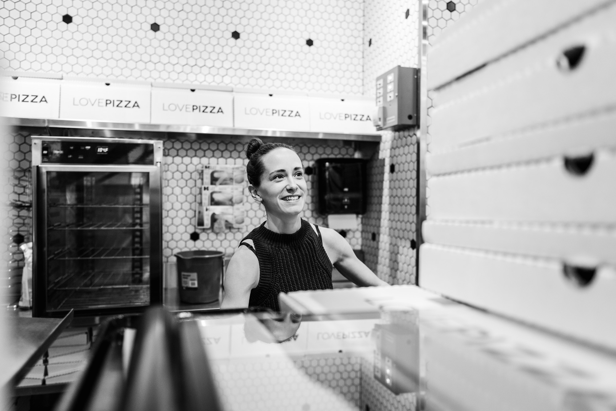 Braede Harris of Love Pizza works at her Edmonton pizza restaurant