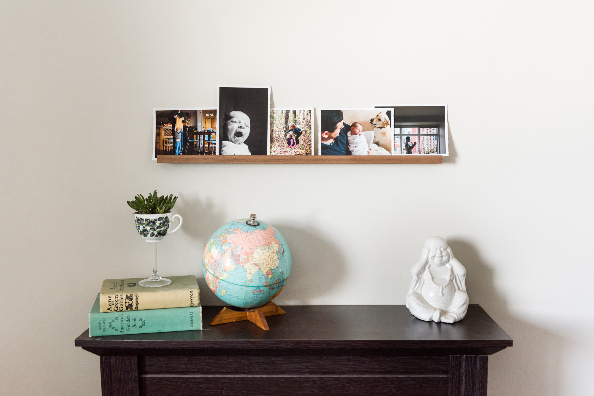 A beautiful walnut floating shelf featuring torn edge prints