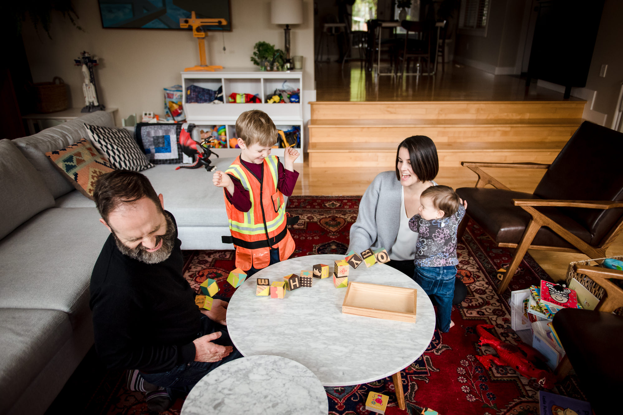 A family plays toys during an Edmonton family photo session