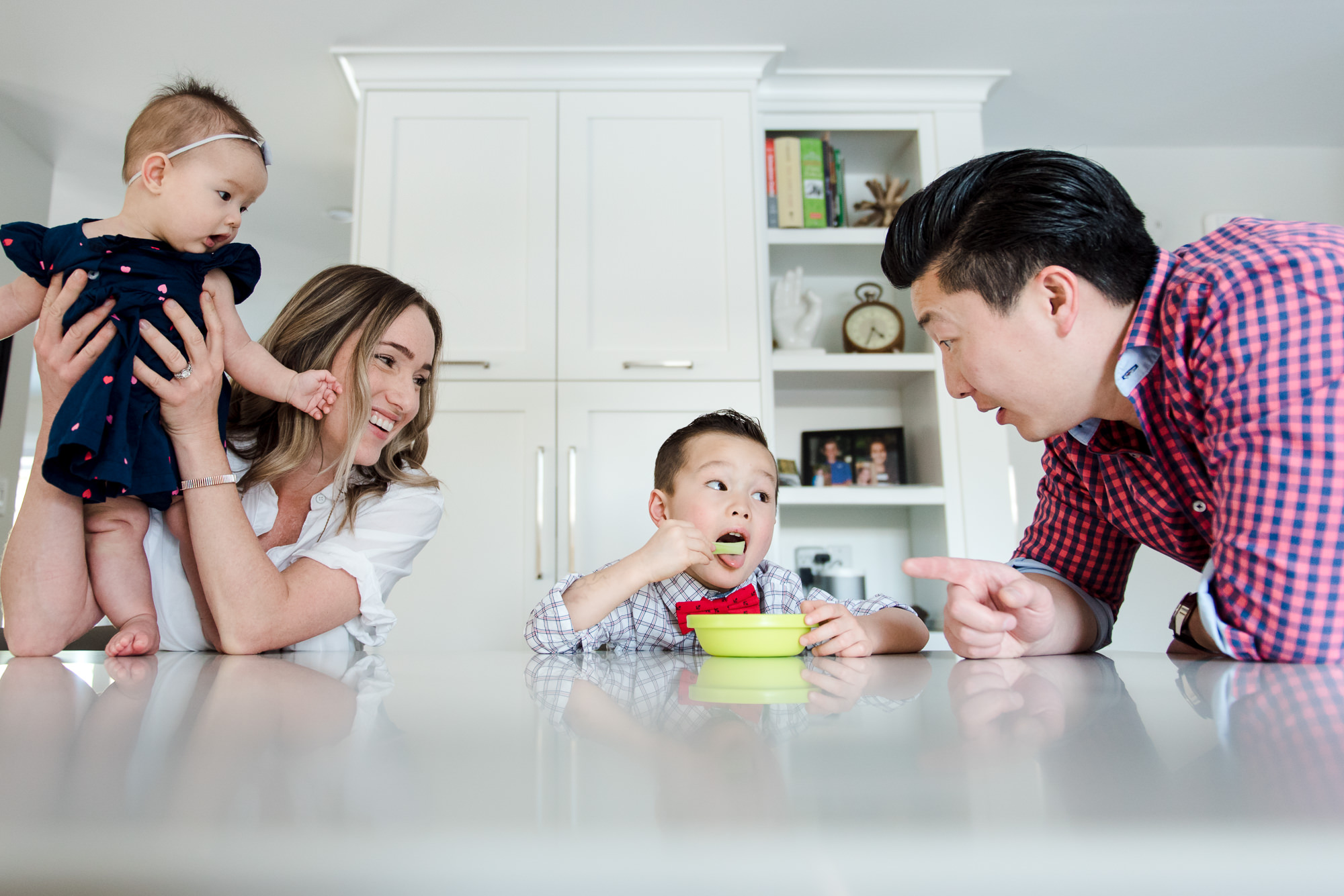 A family spends time in their Edmonton home during a lifestyle family photo session. 