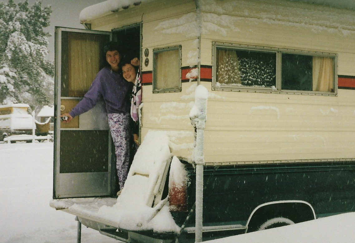 A mother and daughter in a snowy campground