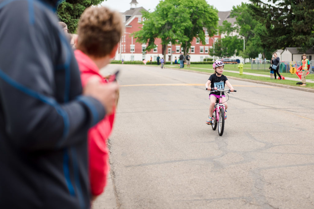 A girl rides a bike without training wheels after participating in Pedalheads day camp in Edmonton

