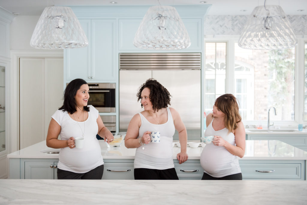 3 women wearing maternity tank tops  from Bravado in an Edmonton home. 