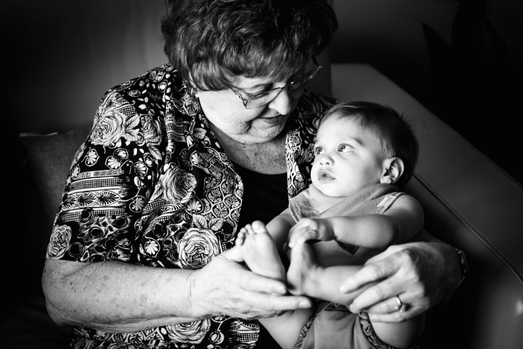 A little boy looks up to his grandmother in a modern portrait from one of the top 100 female photographers to watch in 2020, Kelly Marleau