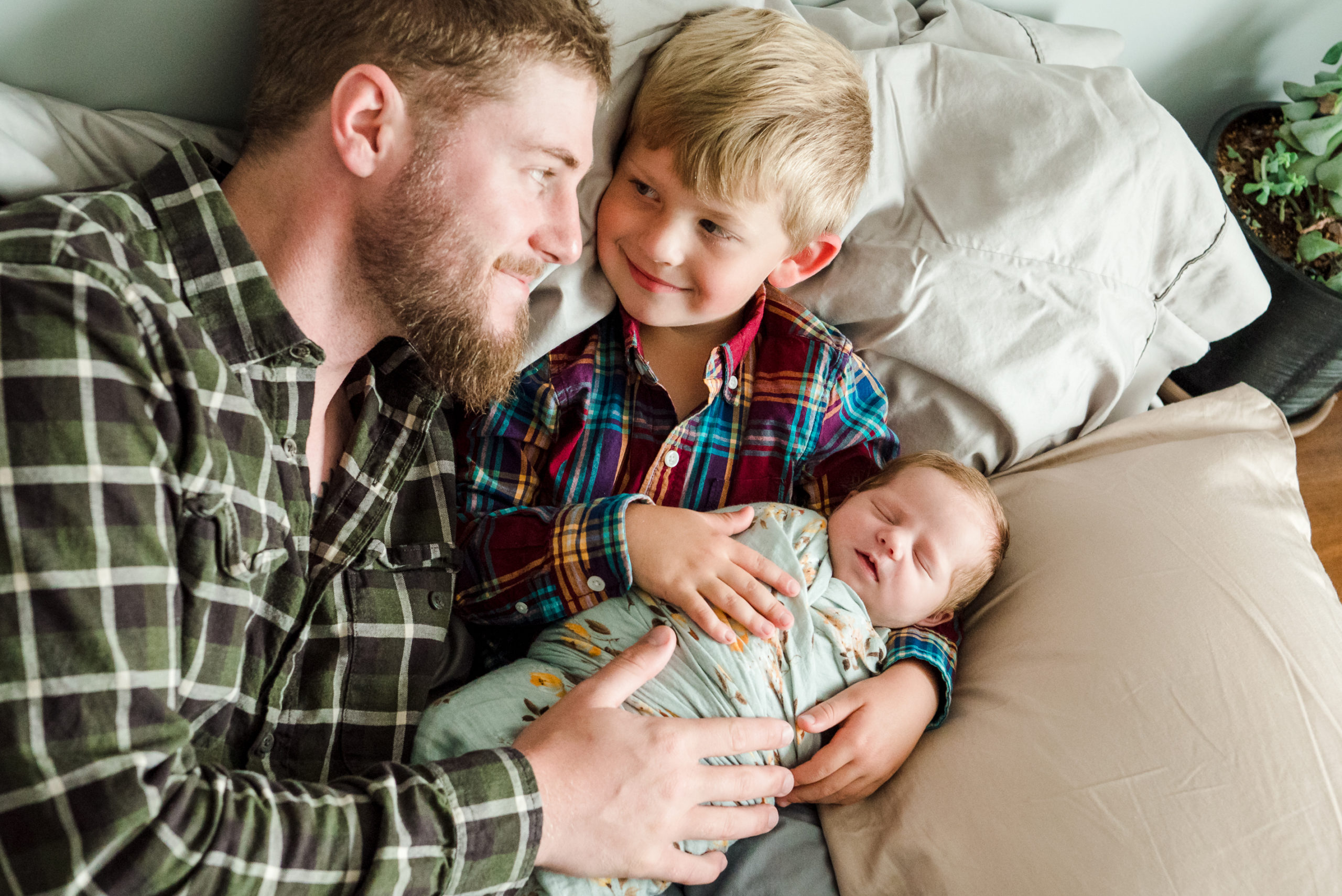 A dad and his kids during a newborn photo session in Ardrossan, Alberta