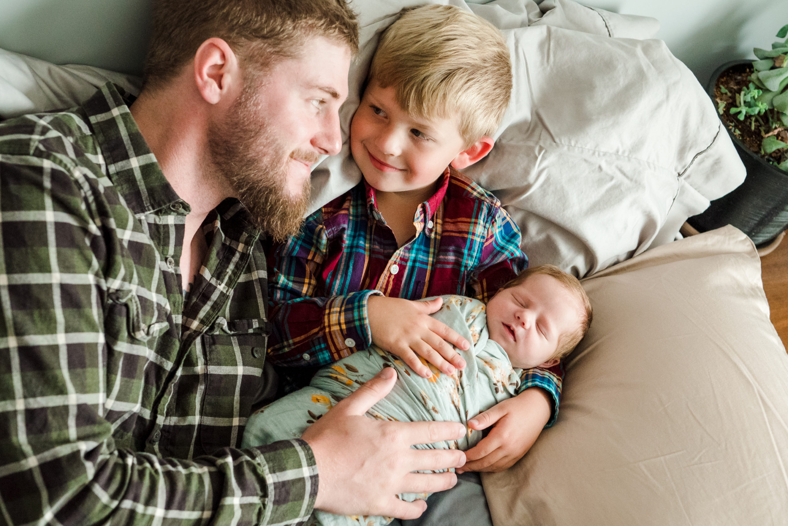 A dad and his kids during a newborn photo session in Ardrossan, Alberta